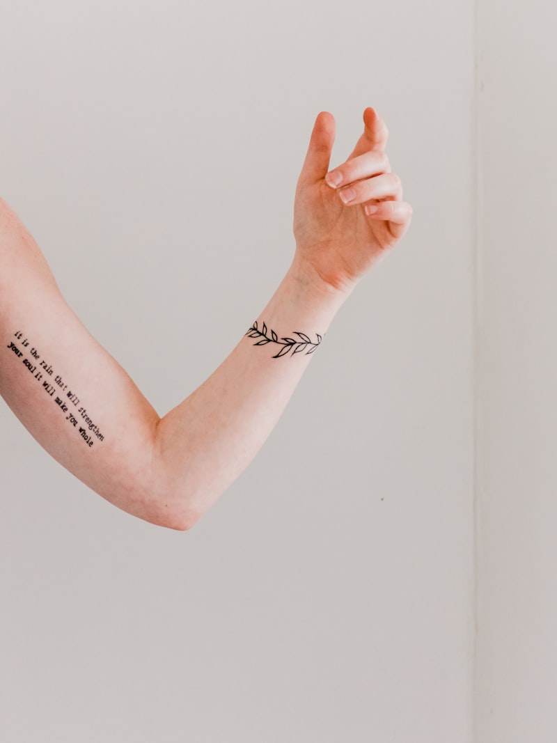 Minimalist semi-permanent tattoo on arm and wrist
